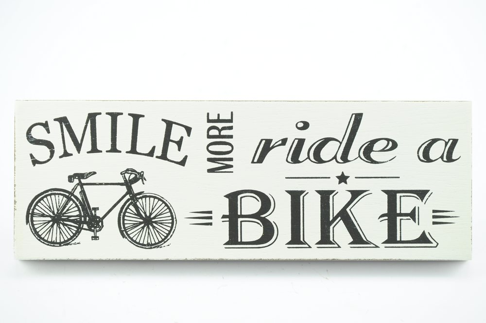 Smile more, ride a bike sign